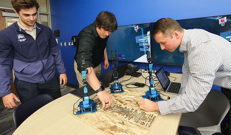 MMU students using robotics equipment